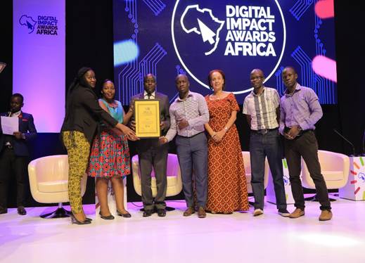UBA Uganda staff show the accolade they won for LEO Chat banking