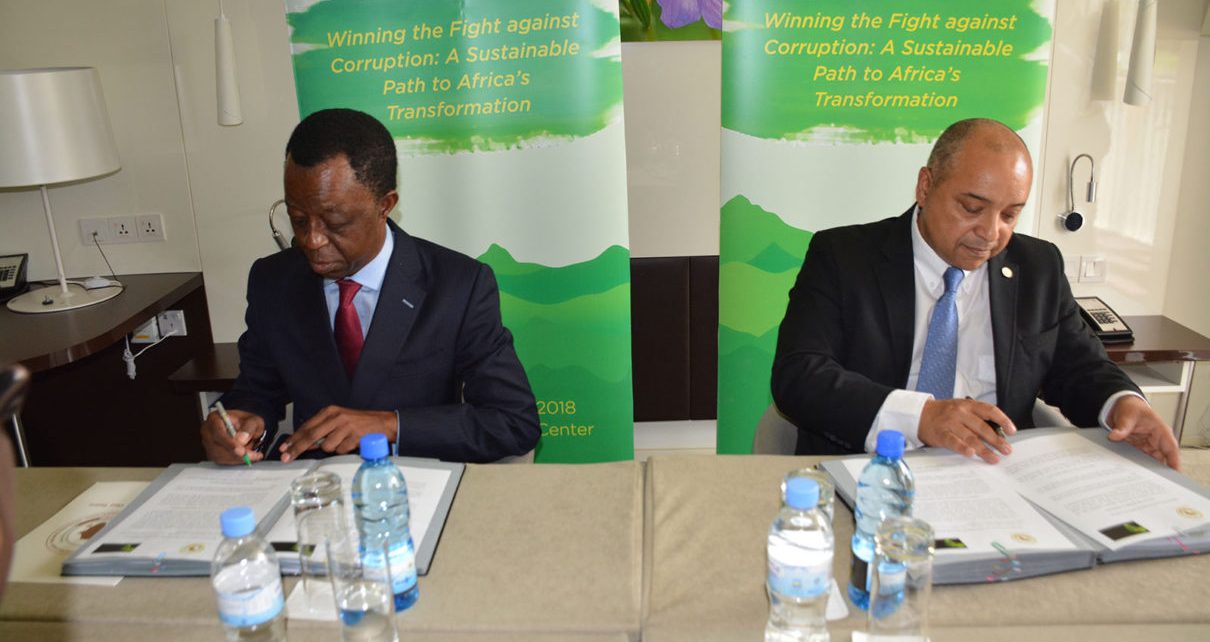 African Tax Administration Forum Executive Secretary Logan WORT and the President of the Pan-African Parliament Roger Nkodo DANG sign documents to strengthen tax laws in Africa