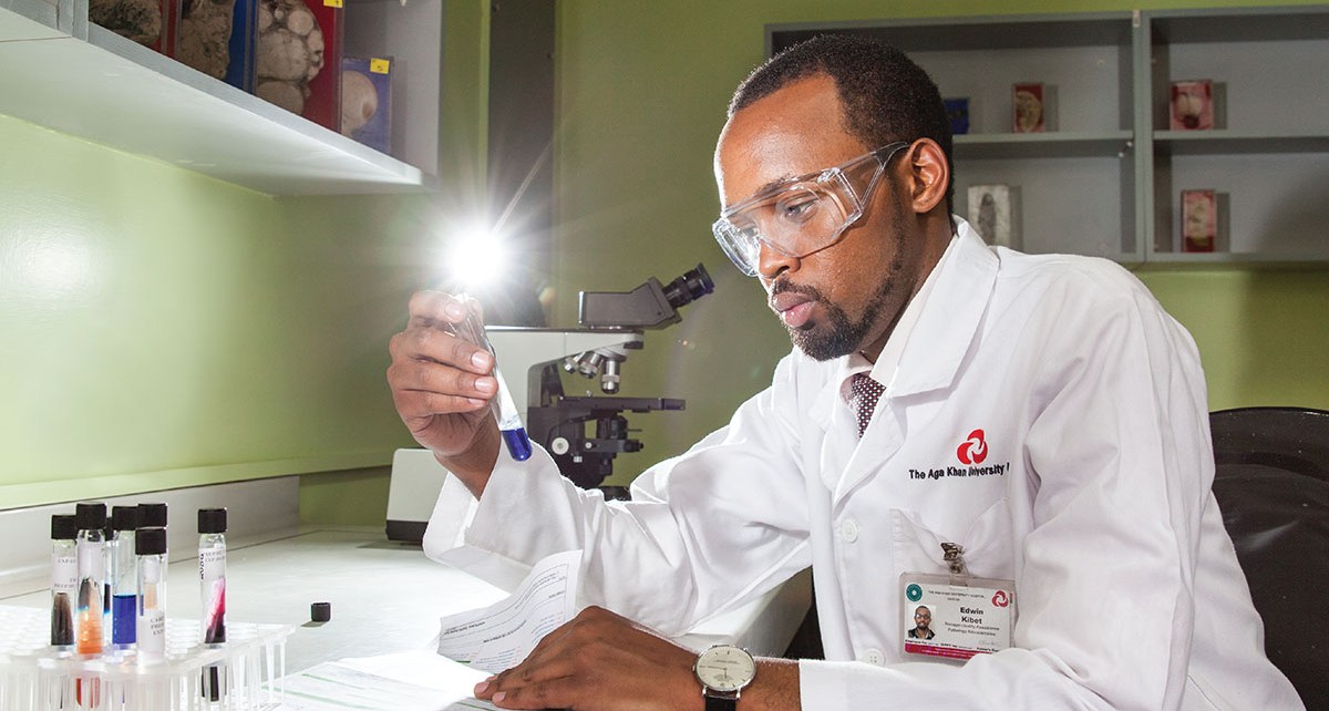A laboratory technologist examines samples at the Aga Khan University Hospital Laboratory. In July 2003, the hospital became the first hospital in East Africa to be awarded the prestigious ISO 9001:2000 (now ISO 9001:2008) by the International Organization for Standardization,
