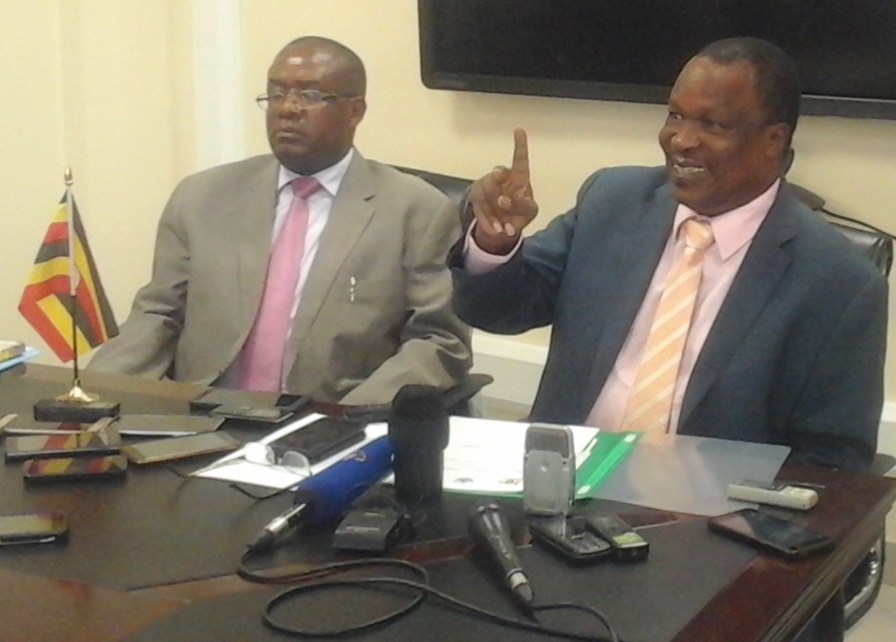 Water and environment Minister Sam Cheptoris (right) addressing the press in Kampala early in the week
