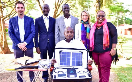 President Yoweri Kaguta Museveni carrying some a package of some of the products manufactured by Fonix industry as he posed for a photograph with a team from the Fonix industry shortly after their meeting at State House Nakasero on Saturday 30th March 2019.