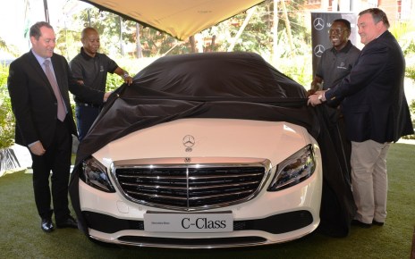 Ian Middleton (left), the Managing Director of DT Dobie Edward Githinji (Second left), Sales Executive, Gerald Trempont (right), CFAO Brand Manager and Lawrence Kiambati (second right), Senior Sales Executive unveil the new Mercedes Benz C Class luxury saloon for the Kenya market.