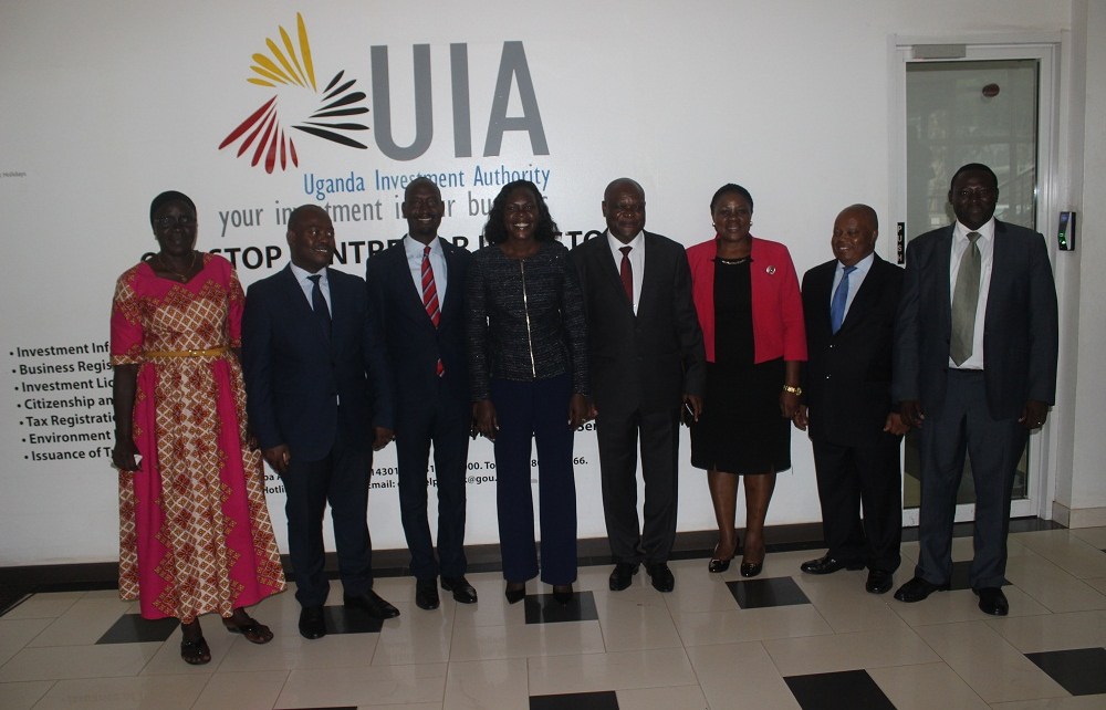 Uganda's State Minister for Investment Evelyn Anite (4L) with the New Board Members of Uganda Investment Authority.