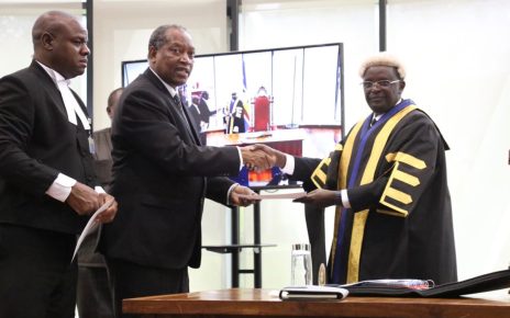 The Minister for Foreign Affairs and East African Co-operation, United Republic of Tanzania, Prof Palamagamba Kabudi takes the oath of Allegiance administered by EALA Clerk Assistant, Victor Manzi