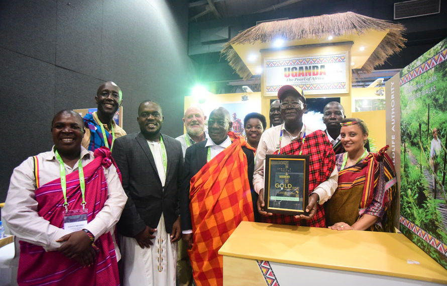 Prof. Ephraim Kamuntu, the Minister of Tourism Wildlife and Antiquities holds the Gold Award certificate presented to Uganda Tourism Board in the category of Southern Africa Development Community and Africa.