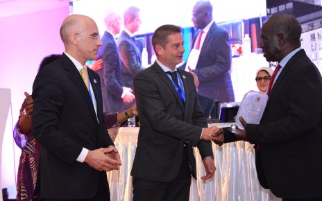The Vice President of Uganda, Edward Kiwanuka Ssekandi (Right) hands over an award of exceptional performance and contribution towards viral Hepatitis response in Uganda and the world, to Nicolas Granier, General Manager Africa (Centre) Infectious Disease - Markets, Rapid Diagnostics, Abbott and Jerome Clavel (Left), VP Global Marketing, Infectious Disease - Emerging Markets, Rapid Diagnostics, Abbott, during the opening ceremony of the Africa Hepatitis Summit at Speke Resort Munyonyo. Abbott is a manufacturer of medical diagnostics devices and kits.