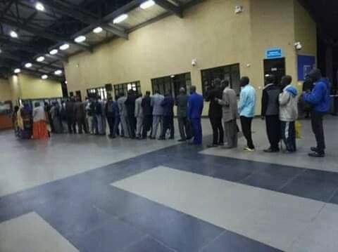 Rwandans lining up at immigration before deportation.