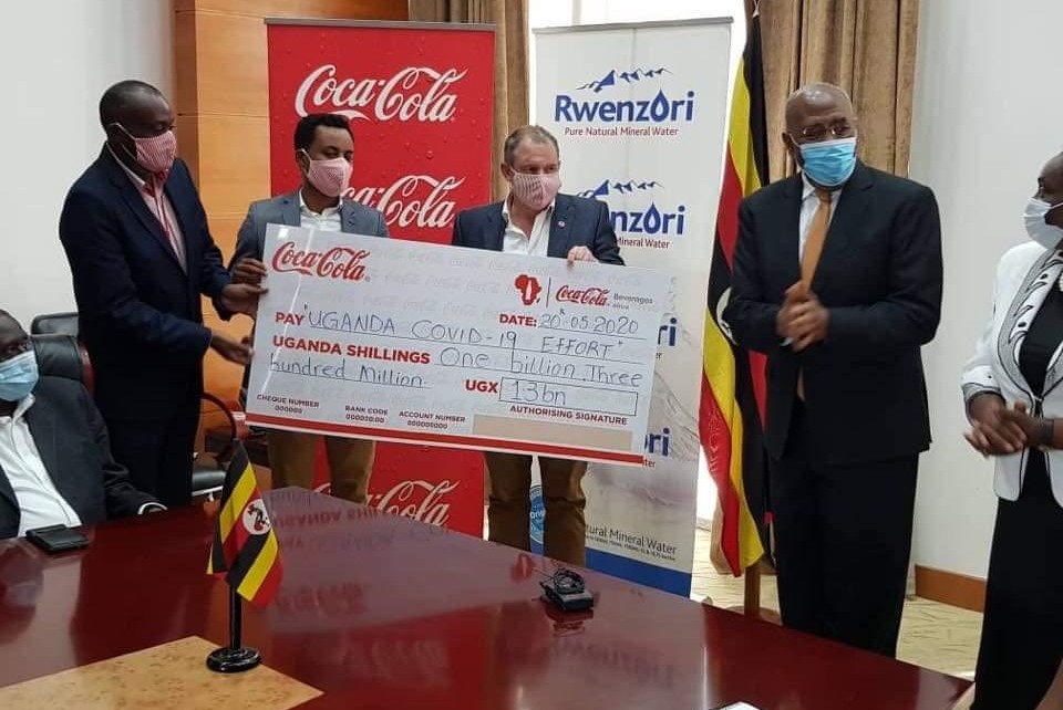 Coca-Cola Beverages Africa in Uganda has handed over its contribution of UGX1.3billion (One Billion, Three Hundred Million Shillings) with three brand new pick-up trucks added to the Ministry of Health COVID-19 fleet.