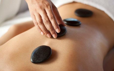 A hot stone massage is a type of massage therapy. It’s used to help you relax and ease tense muscles and damaged soft tissues throughout your body.