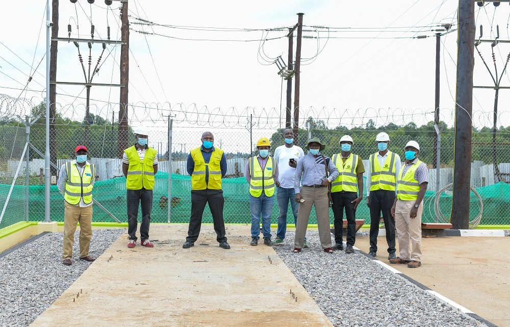 Umeme Managing Director Selestino Babungi inspecting the over sh7b new Tororo rural access line built recently.jpg
