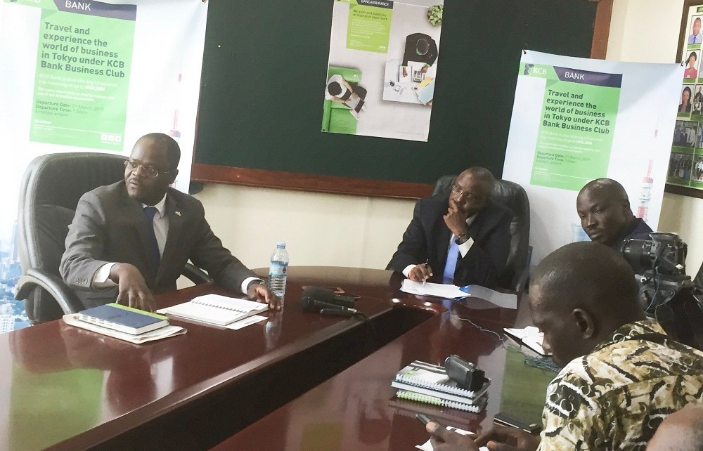 L-R Godfrey Ssenteza, KCB's senior manager SME, MD Edgar Byamah and Samuel Matekha address journalists during the launch of KCB's Trip to Tokyo.jpg