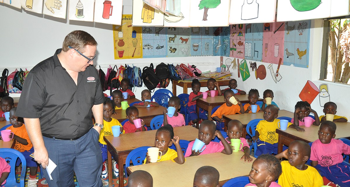 Plascon’ s Retail Marketing Manager Mr. Tyron Immelman interacts with pupils of Mother Ludia Nursery school in their newly painted classroom